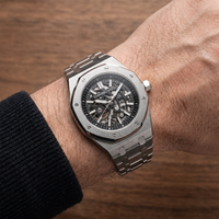 Empire Luxe Bastion on the wrist over wood